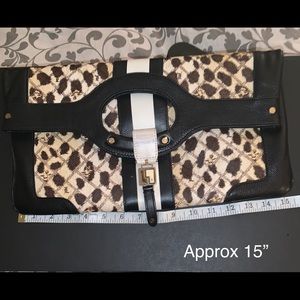 L.A.M.B. brand clutch or tote.